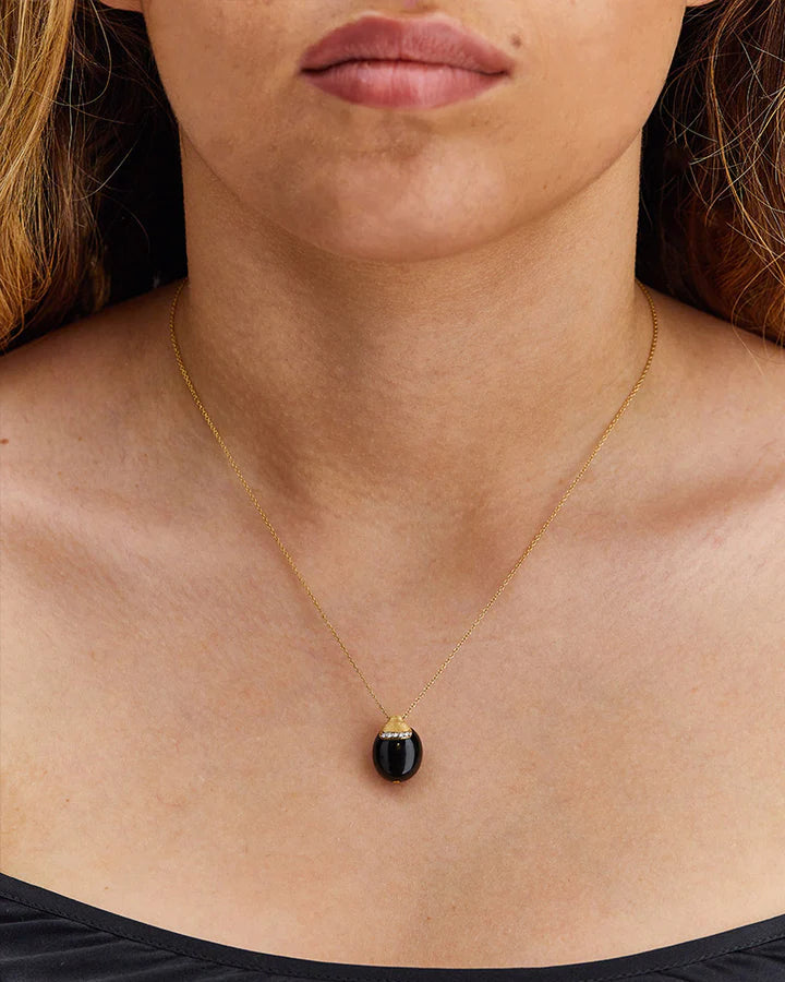 "MYSTERY BLACK" BLACK ONYX BOULE EMBRACED BY GOLD AND A DIAMONDS ACCENT