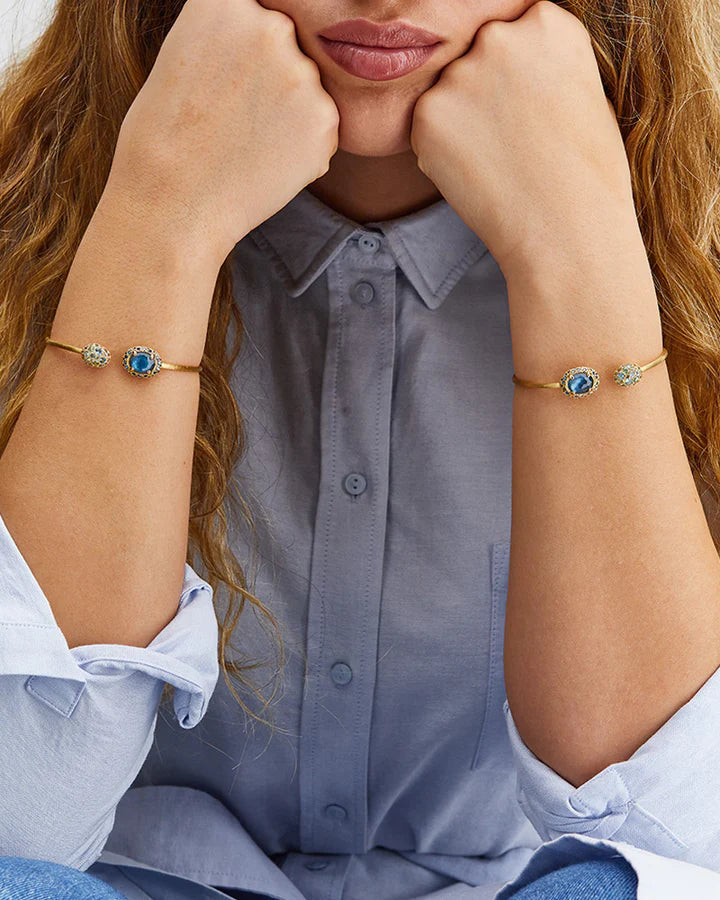 "REVERSE" GOLD, BLUE DIAMONDS, SWISS BLUE TOPAZ, GREEN SAPPHIRES AND LONDON BLUE TOPAZ BANGLE